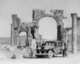 Syria: European tourists by the triple-arched gateway at Palmyra (Tadmur) c.1900